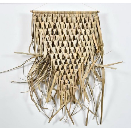 Pleciona dekoracja ścienna z trawy jest jedną z najlepszych opcji na ozdobienie ściany w sypialni w stylu boho.