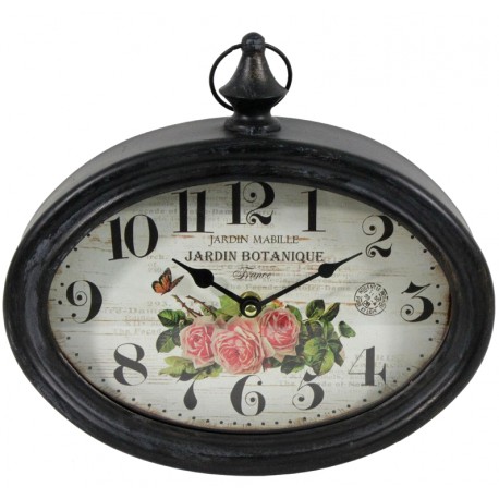 owalny zegar w czarnej metalowej ramie i białą tarczą z motywem róż