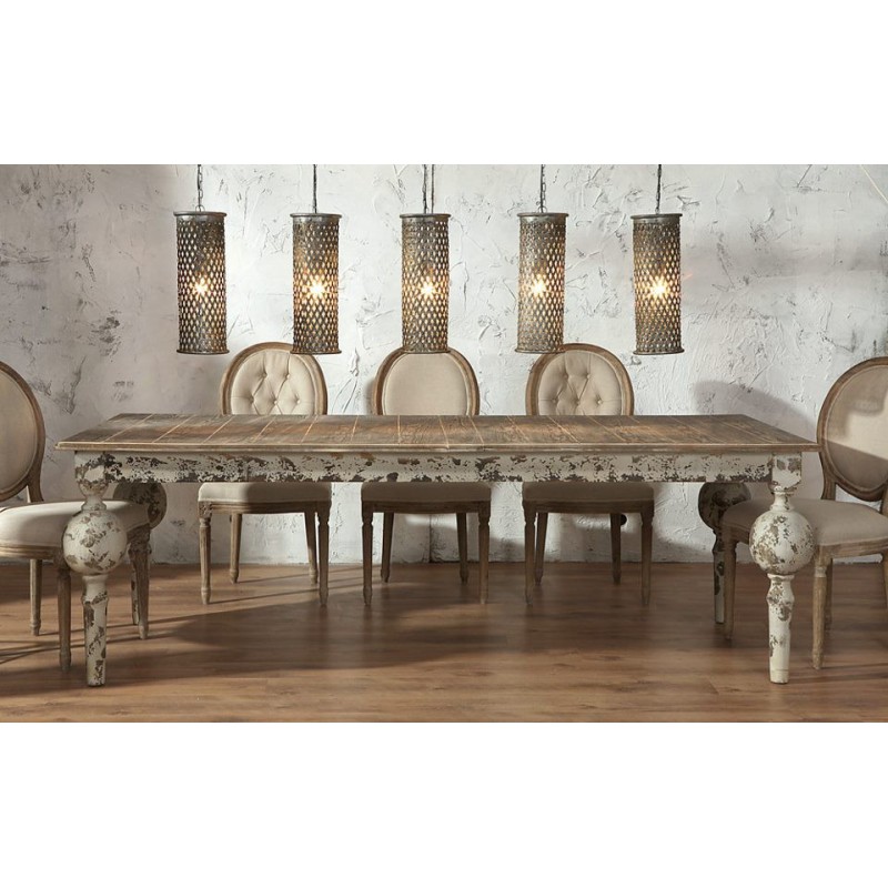 Prowansalski stół Grigio Belleco z celowymi obdrapaniami farby. Stół ma brązowo-kremowy kolor, ale jego cechą charakterystyczną są kule przy nogach.