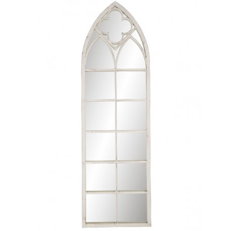 Wąskie lustro w białej ramie przypomina okno