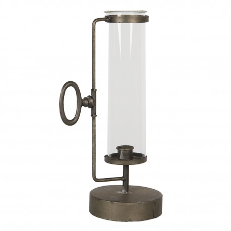 Metalowy świecznik w stylu industrialnym z pozoru przypomina starą, stojącą probówkę.